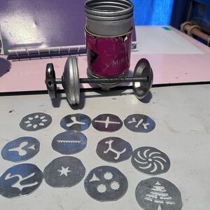 Vintage Mirro aluminum cookie press with multiple decorative metal discs.